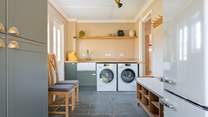 There is a fully equipped utility-room with an extra fridge/freezer.