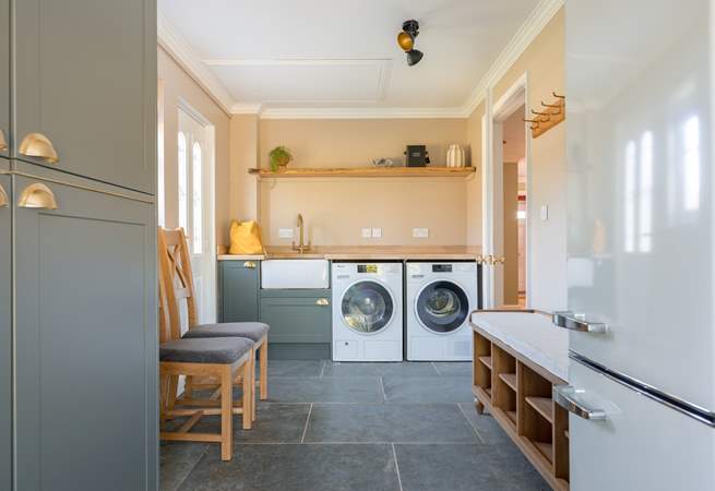 There is a fully equipped utility-room with an extra fridge/freezer.