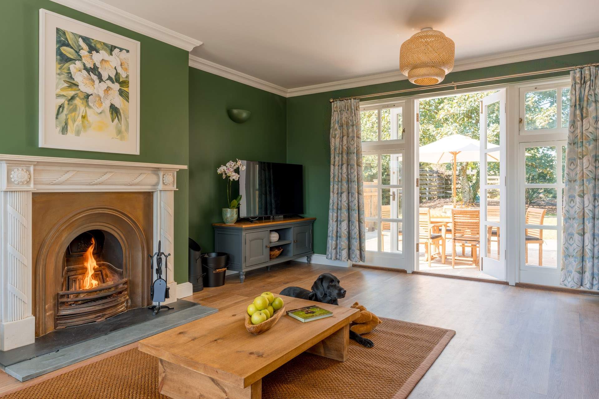 French doors open onto the back terrace, blending indoor comfort with outdoor living.