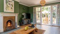 French doors open onto the back terrace, blending indoor comfort with outdoor living.