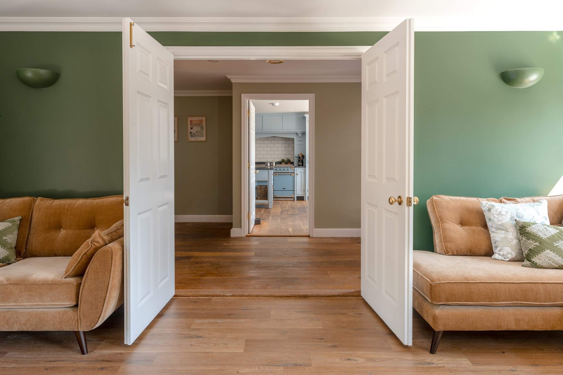 Cross the polished wooden floors into the kitchen.