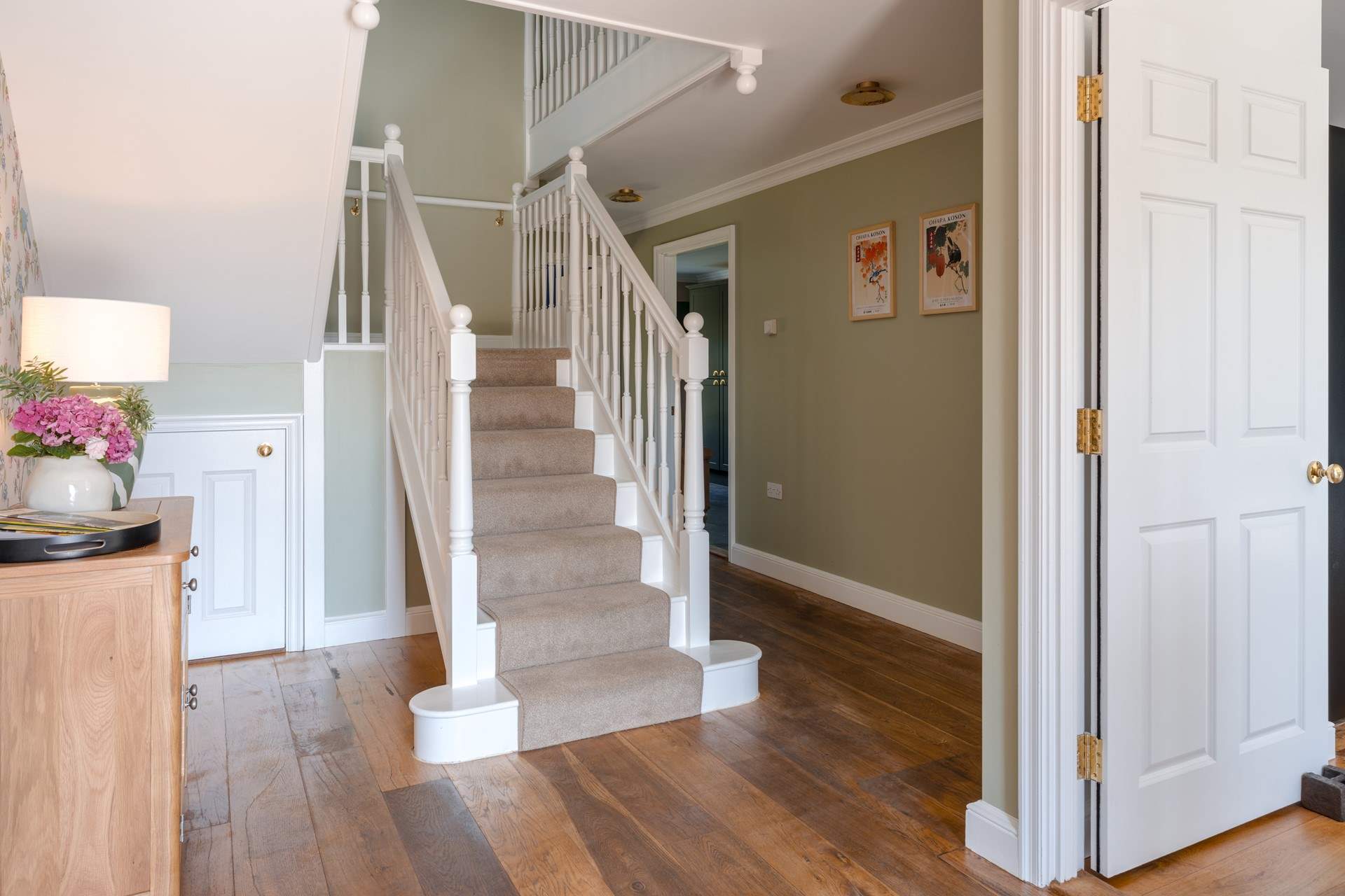 Head upstairs on the grand staircase.