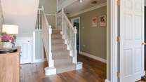 Head upstairs on the grand staircase.