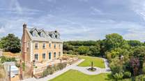 Escape to the heart of the Cornish countryside at Trevaskis Farmhouse with a private hot tub and surrounded by everything this much loved working farm has to offer.