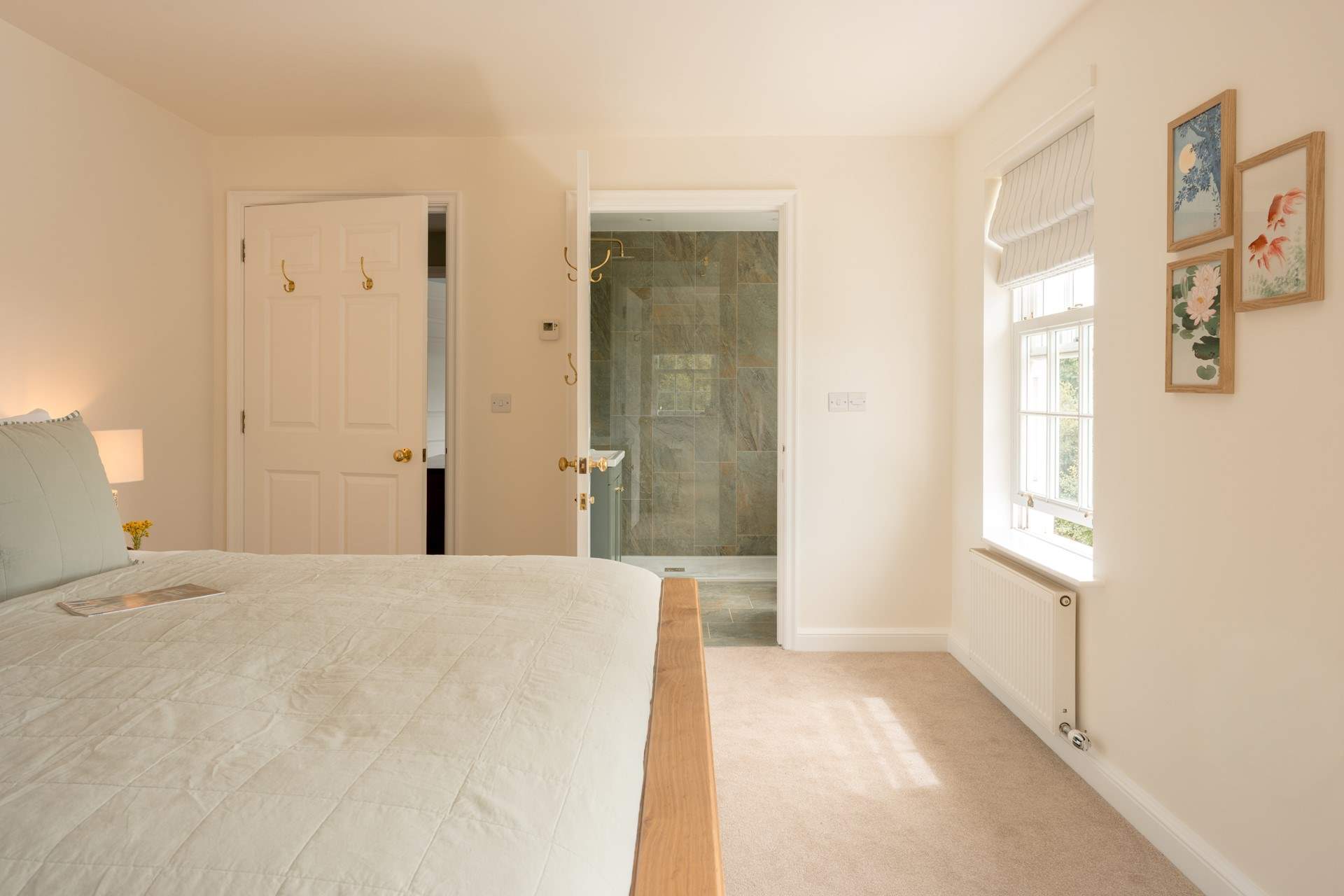 A luxurious bedroom with a super-king bed and its own en suite shower-room with garden views.