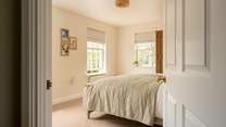 Peep into bedroom 2 filled with natural light.