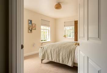 Peep into bedroom 2 filled with natural light.