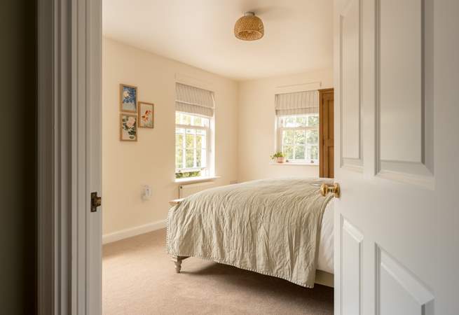 Peep into bedroom 2 filled with natural light.