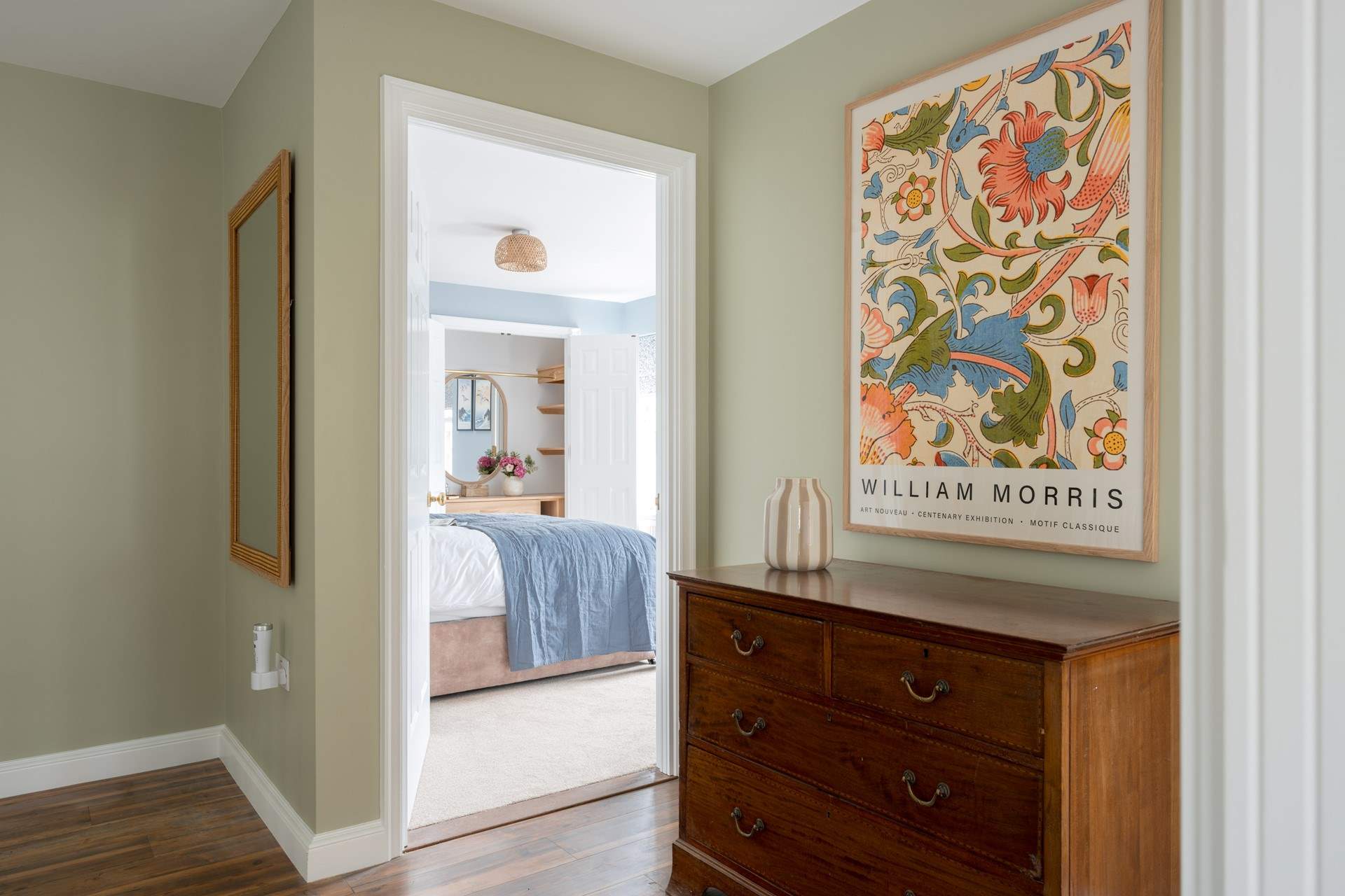 Thoughtfully displayed artwork welcomes you to the bedrooms.