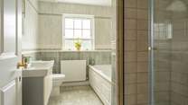 The family bathroom with bath and separate luxury shower on the first floor.