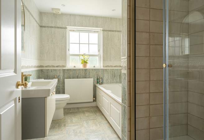 The family bathroom with bath and separate luxury shower on the first floor.