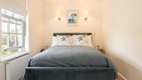 Snuggle up in this sweet bedroom.