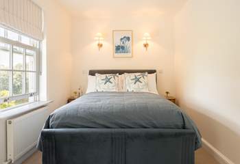 Snuggle up in this sweet bedroom.