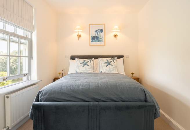 Snuggle up in this sweet bedroom.