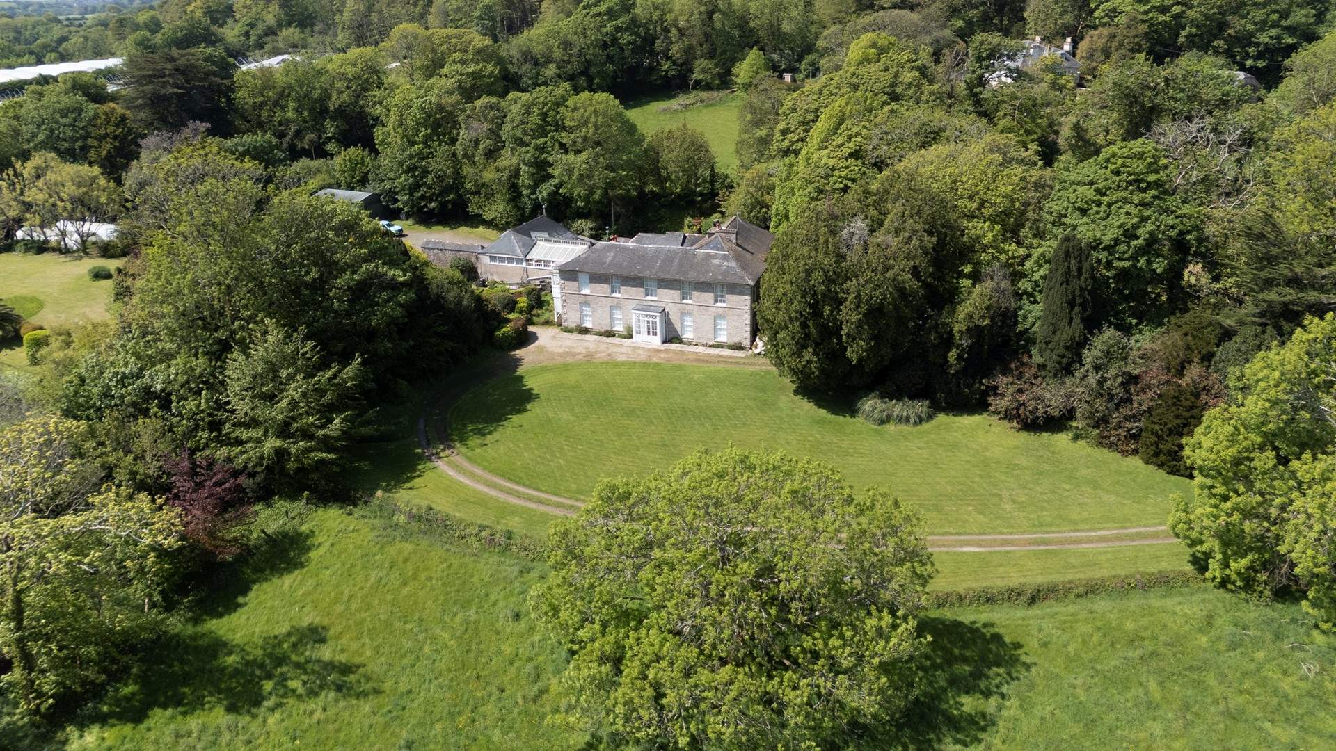 An aerial view of the estate, Apple Loft Cottage is situated on the left attached to the main house.