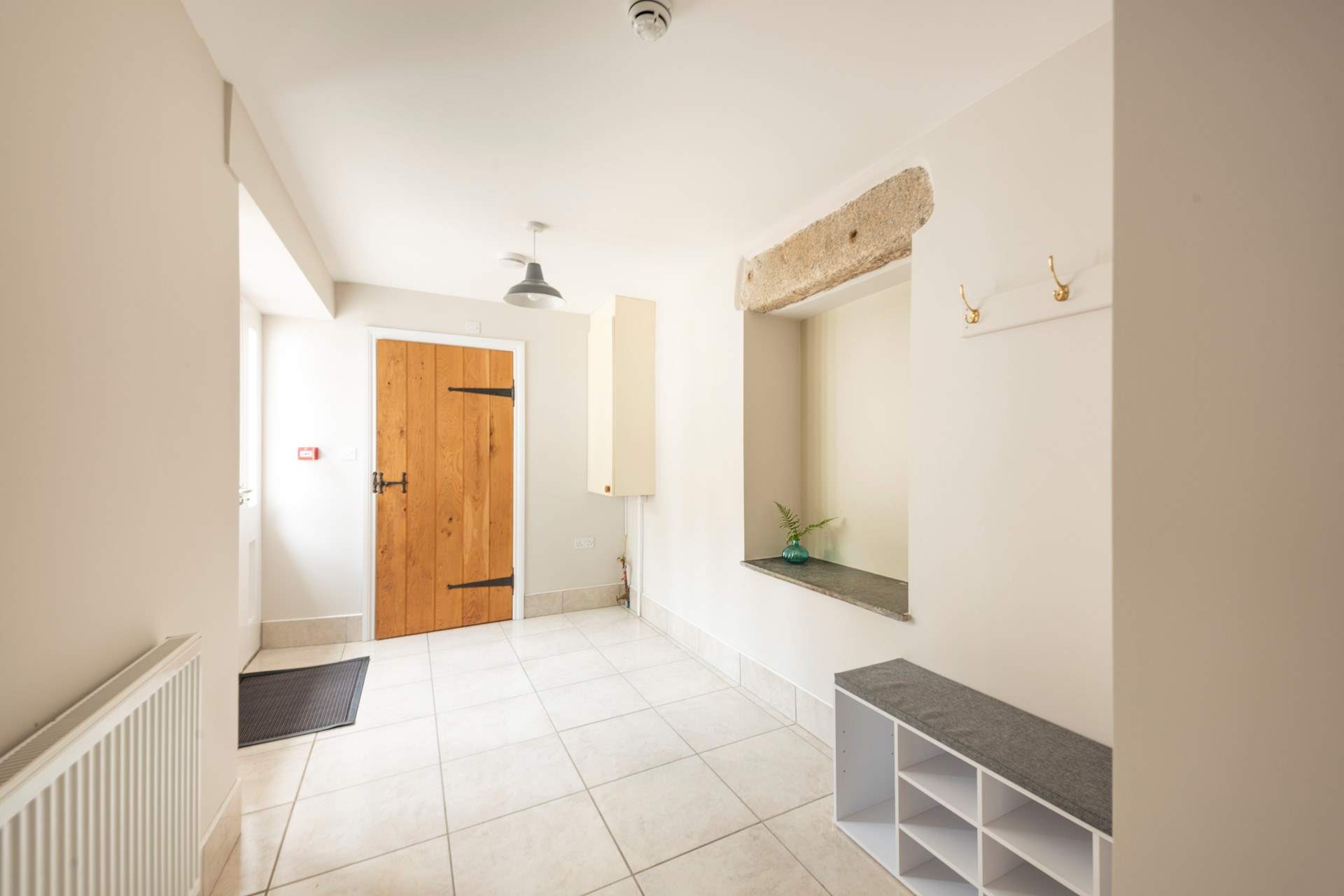 Plenty of space for coats and boots, and a handy cloakroom with a washing machine.