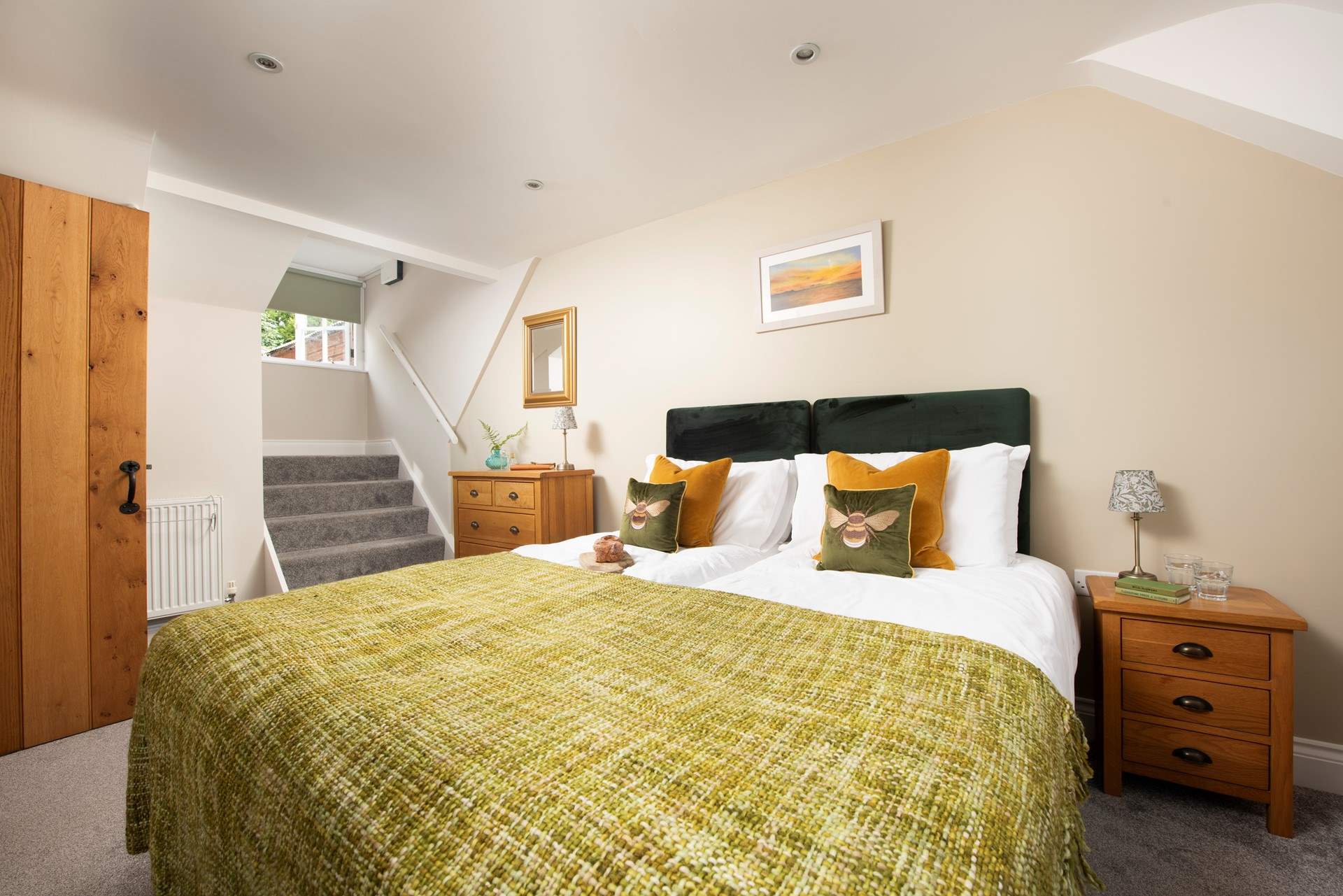 One of the bedrooms has a king-size 'zip and link' with its own en suite shower-room. (Please note the stairs pictured only give reach to the window they do not lead anywhere)