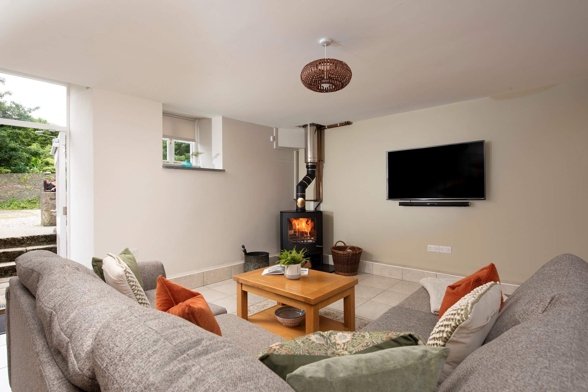 Cosy up beside the wood-burner after a day exploring the Cornish coast.