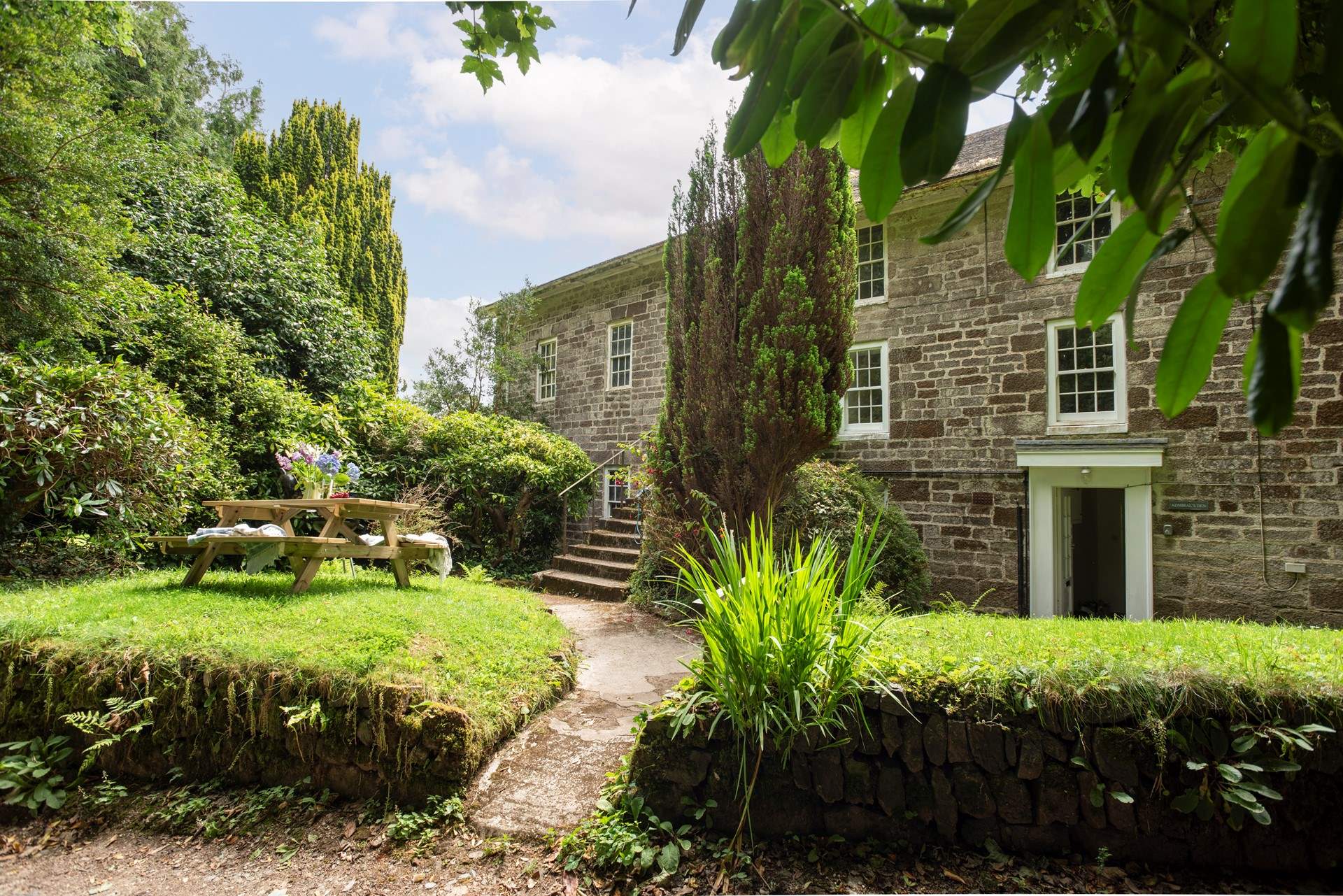 Welcome to Admiral's Den, a stylish ground floor apartment set in the historic splendour of Grade II Listed Nancealverne House.
