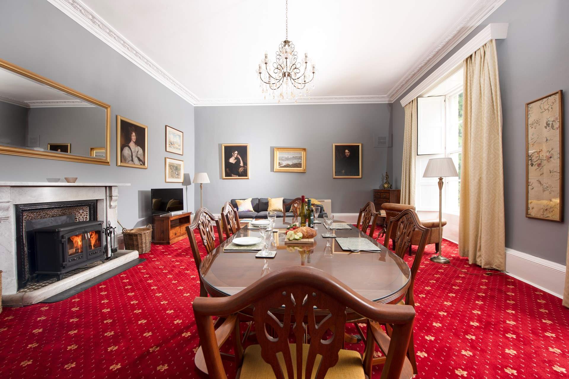 Once a grand drawing-room of the house, this magnificent space is now an elegant sitting and dining-room full of character and period charm.