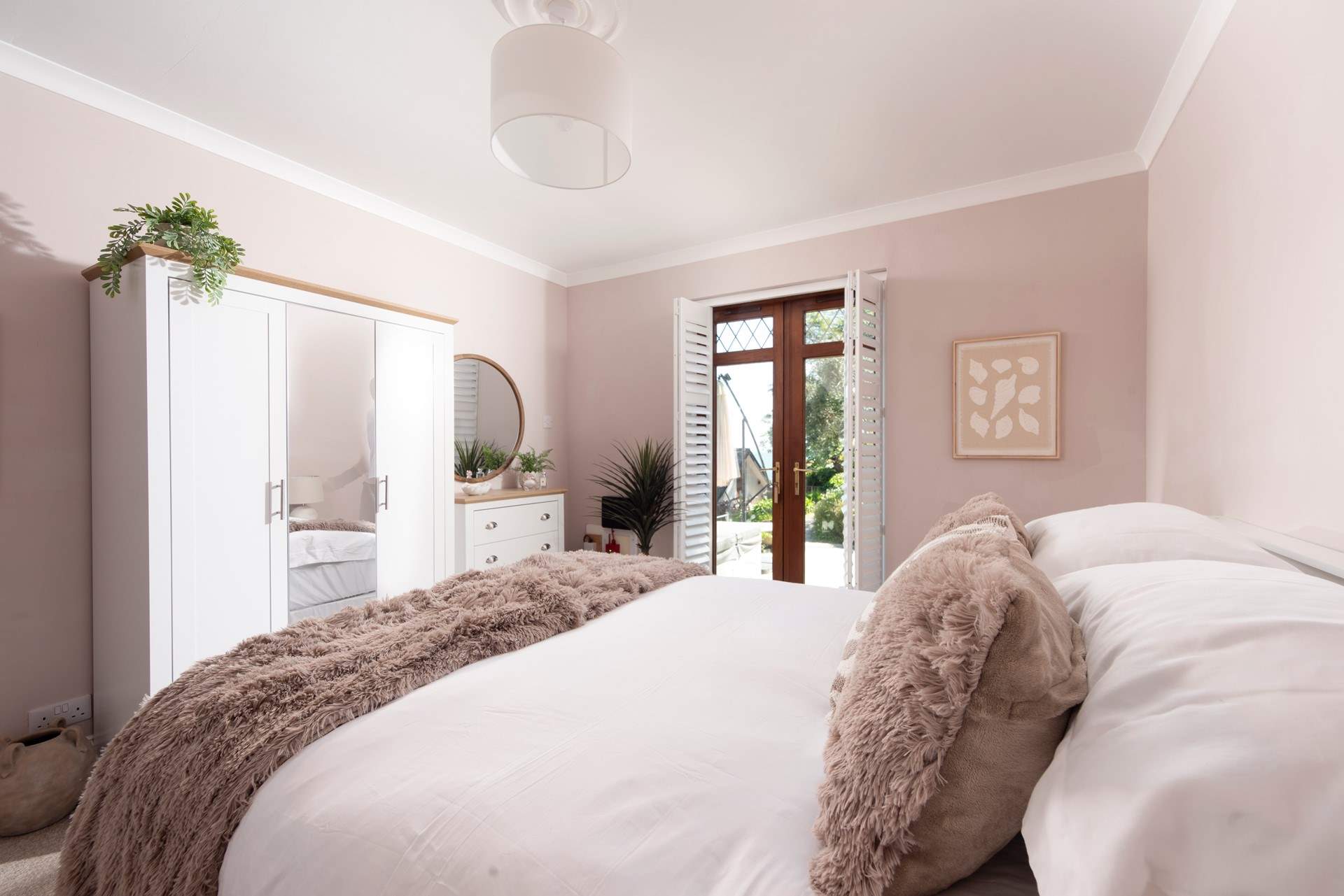 Double doors lead you out to the side terrace.