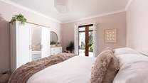 Double doors lead you out to the side terrace.