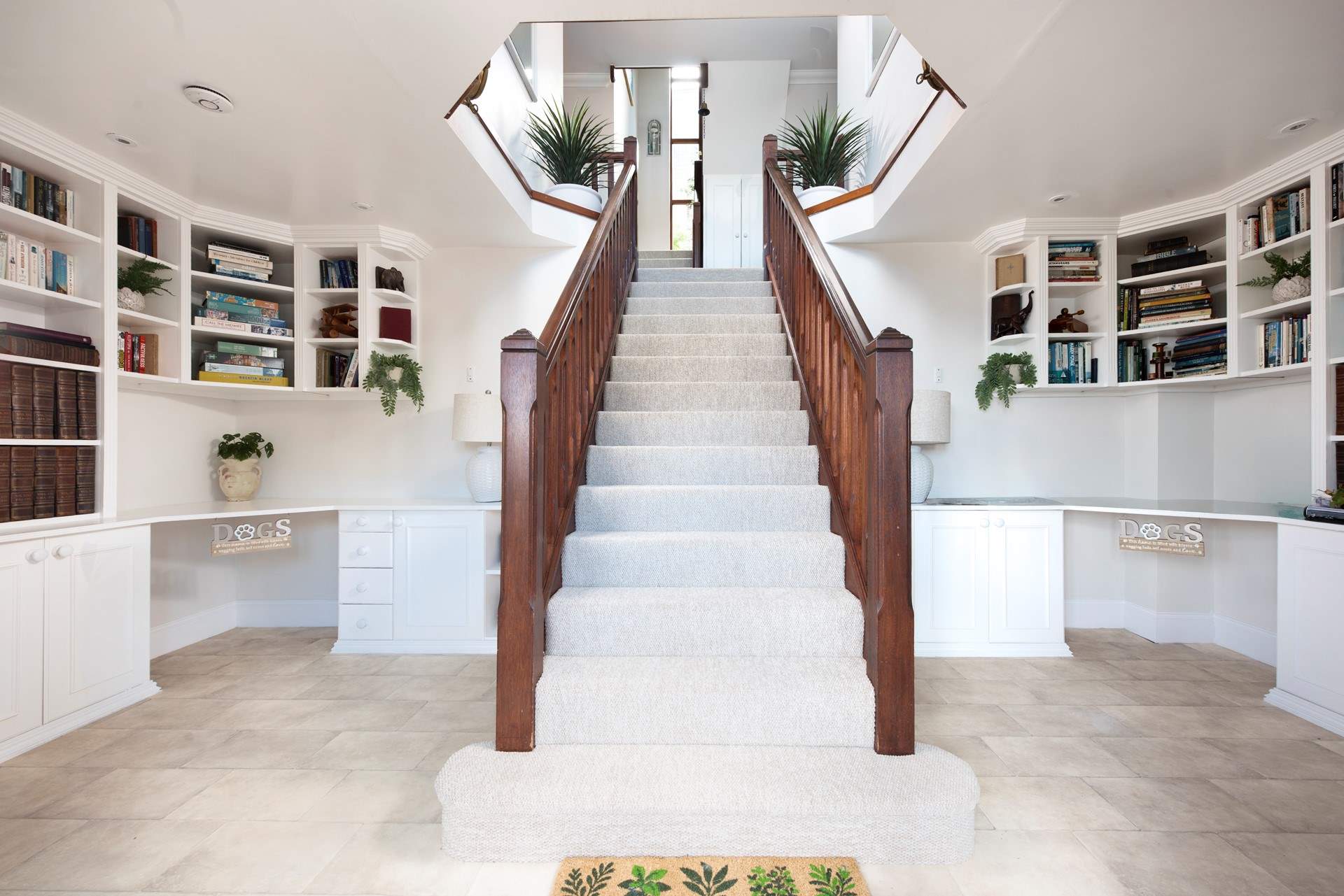 The grand entrance hall creates a warm welcome especially for your four legged friends .