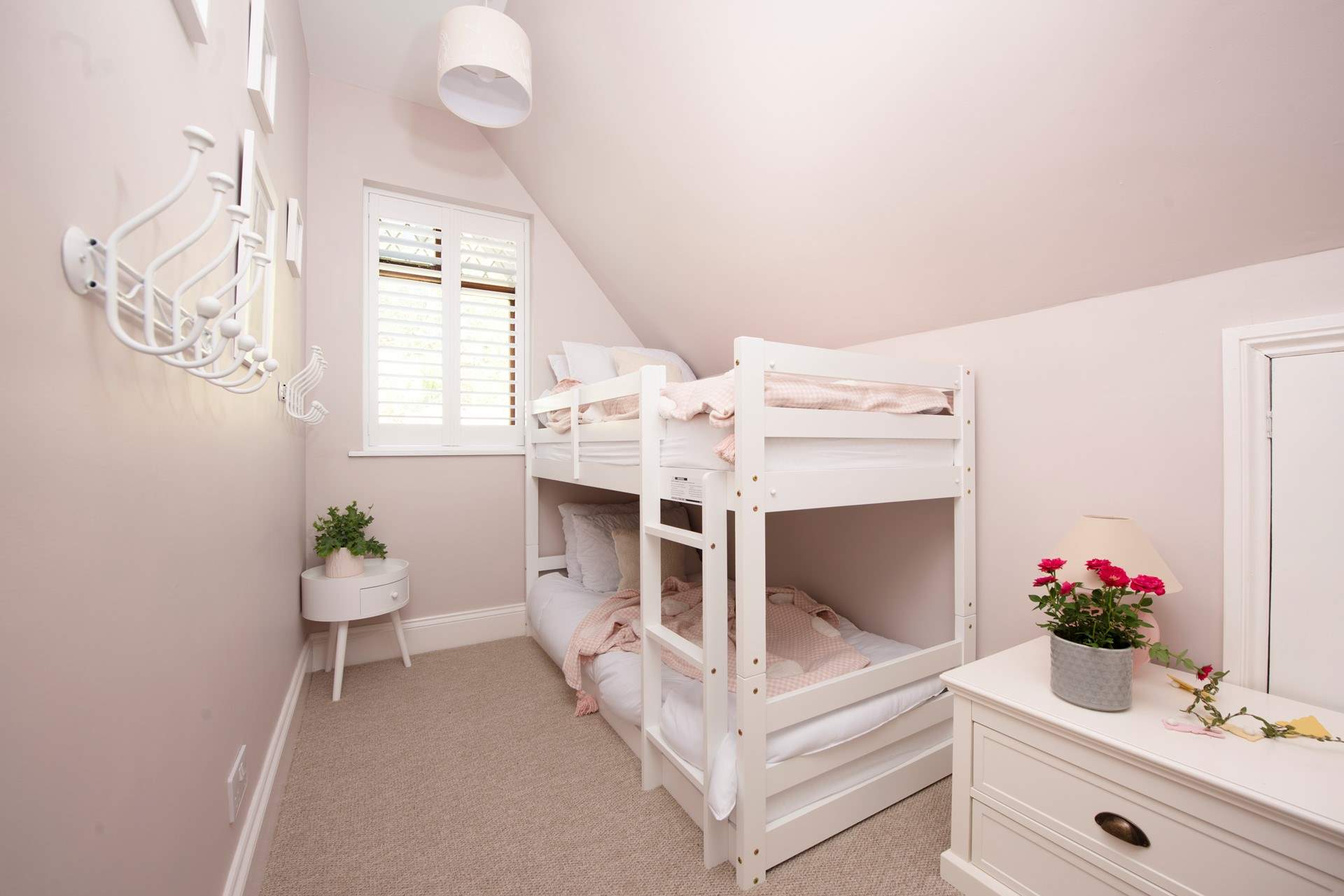 The charming bunk bedded room will delight the younger members of the group.