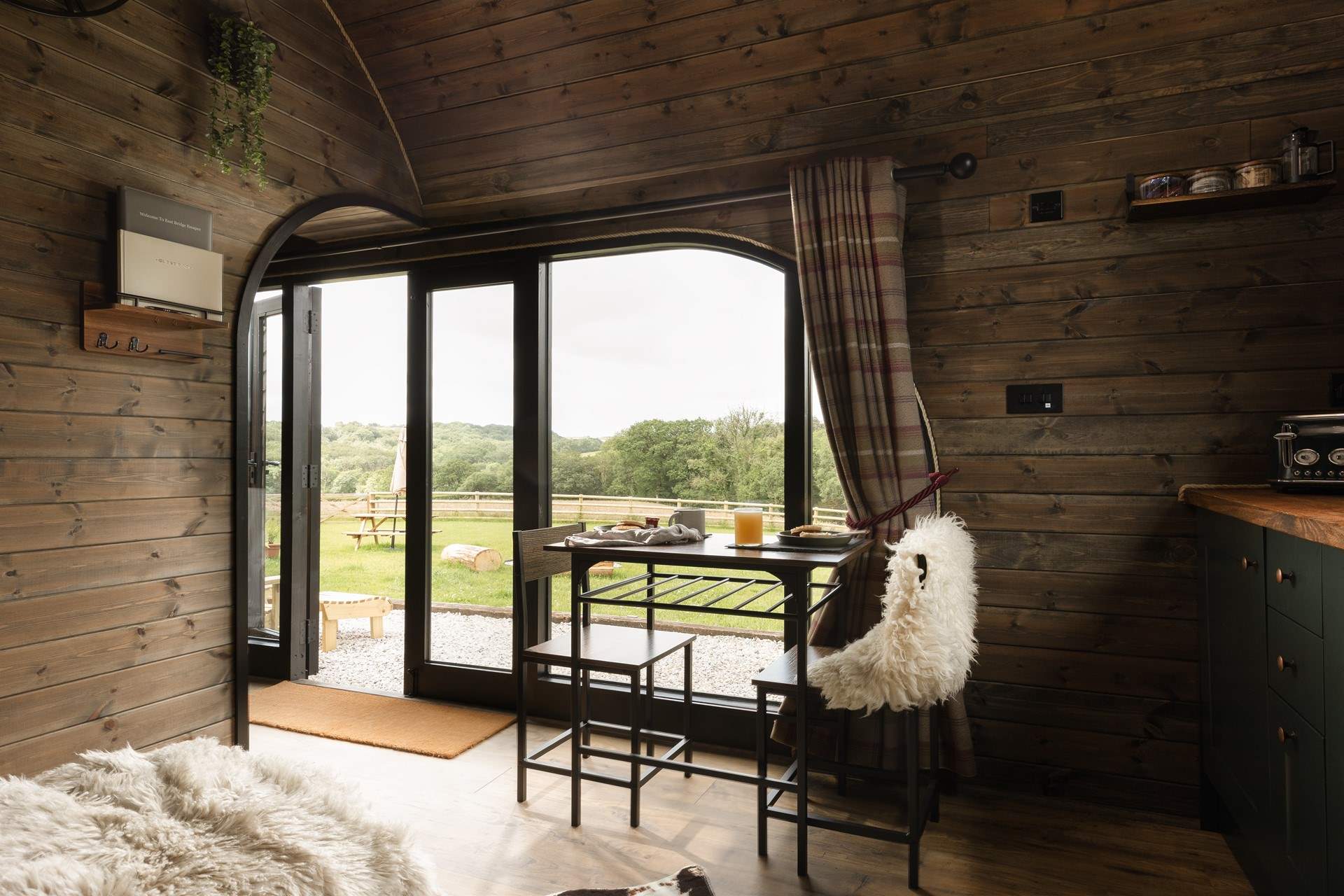 Natural light streams through the cabin from all angles.