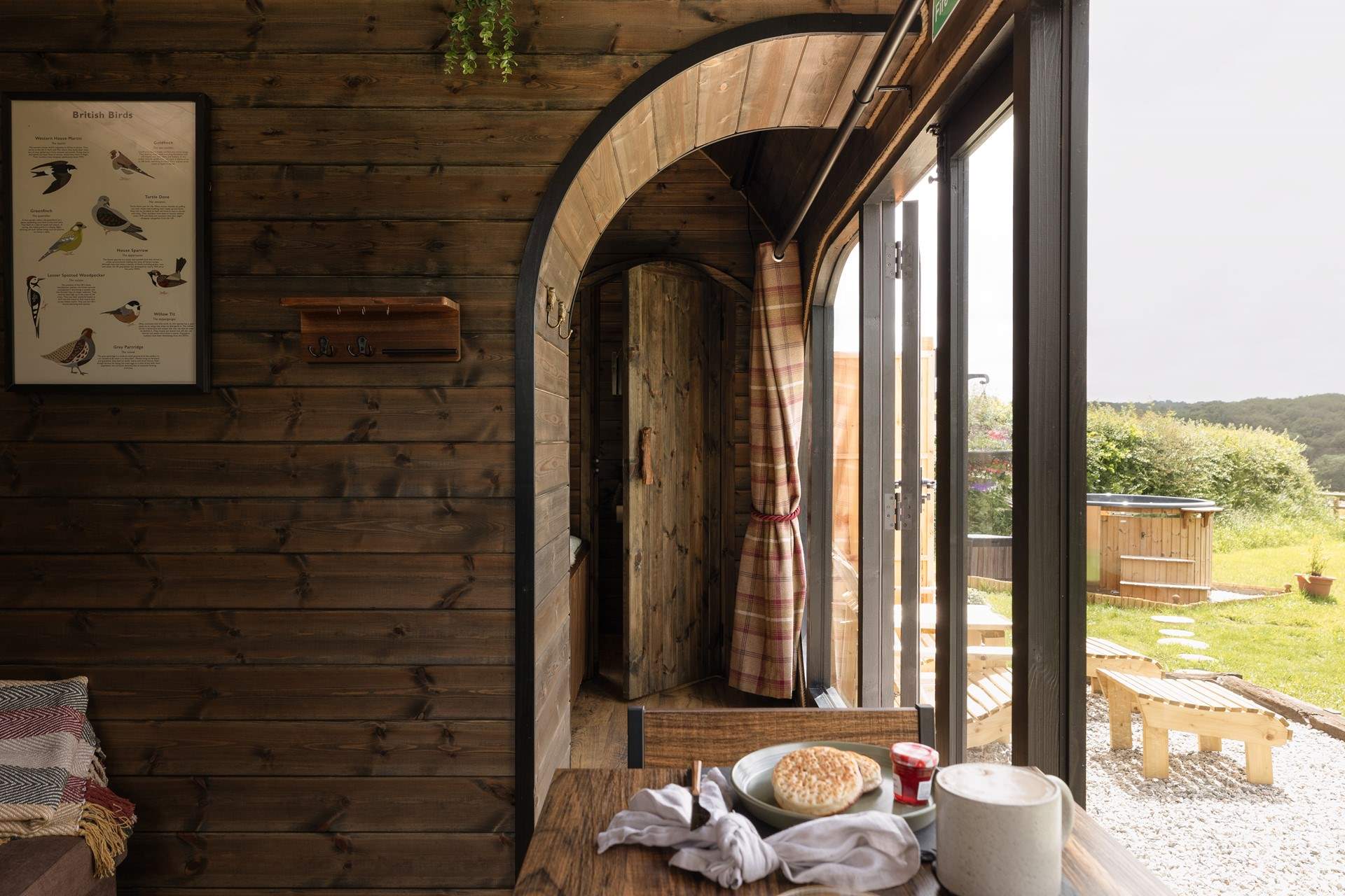 Separated via a bespoke partition, the charming bedroom awaits.