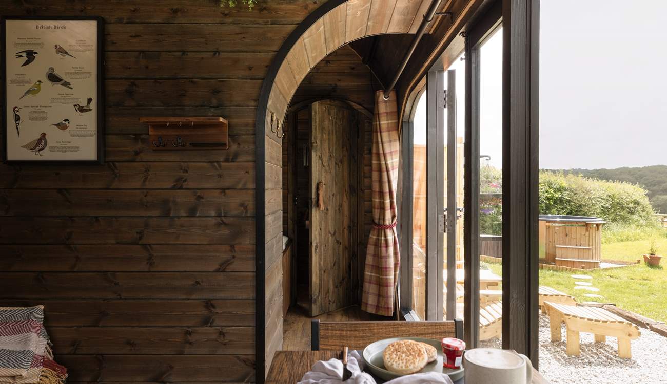 Separated via a bespoke partition, the charming bedroom awaits.