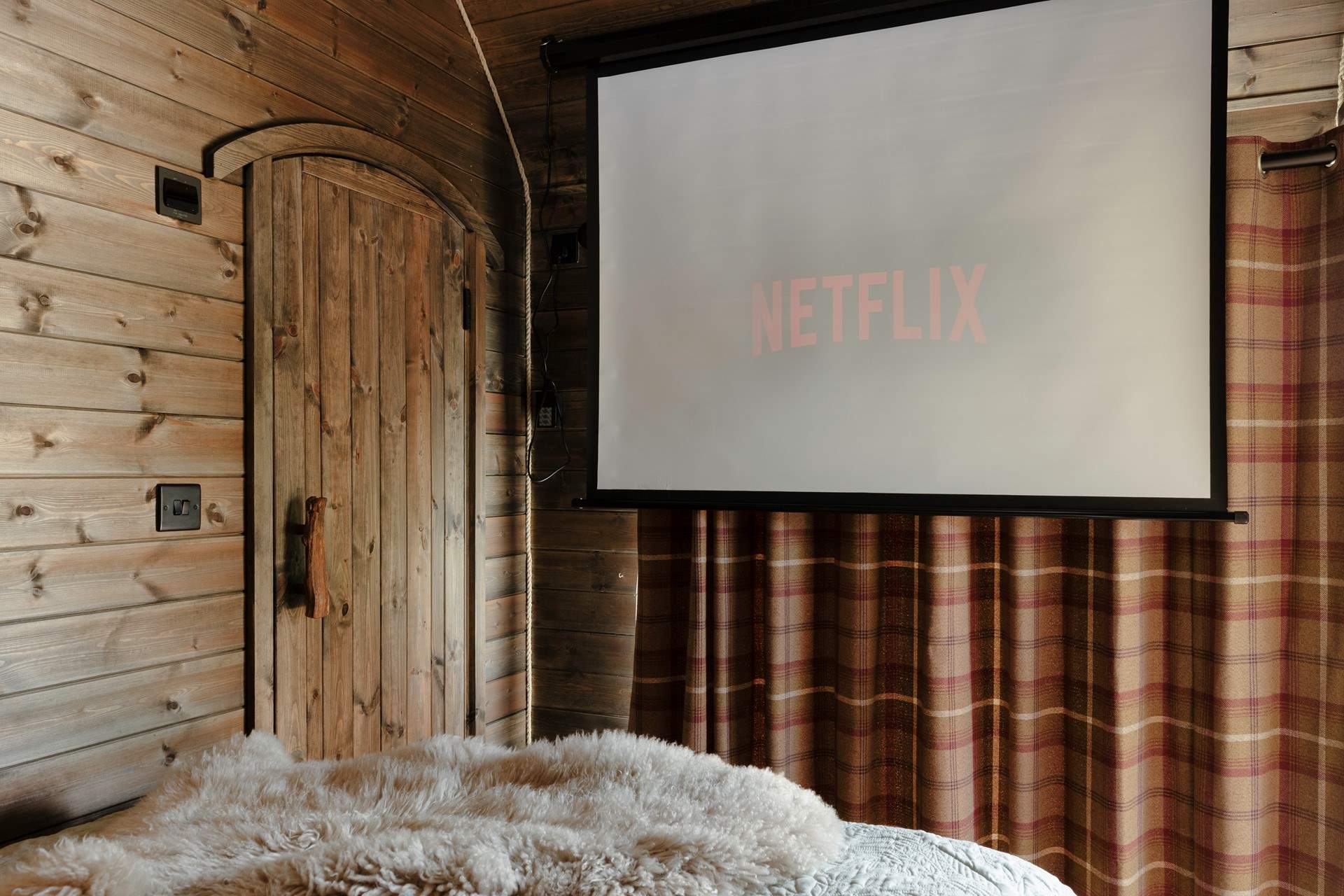 The projector transforms cosy nights in into the perfect cabin cinema experience.