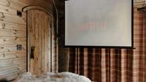 The projector transforms cosy nights in into the perfect cabin cinema experience.