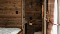 You'll find the sleek shower-room just beyond the bedroom.