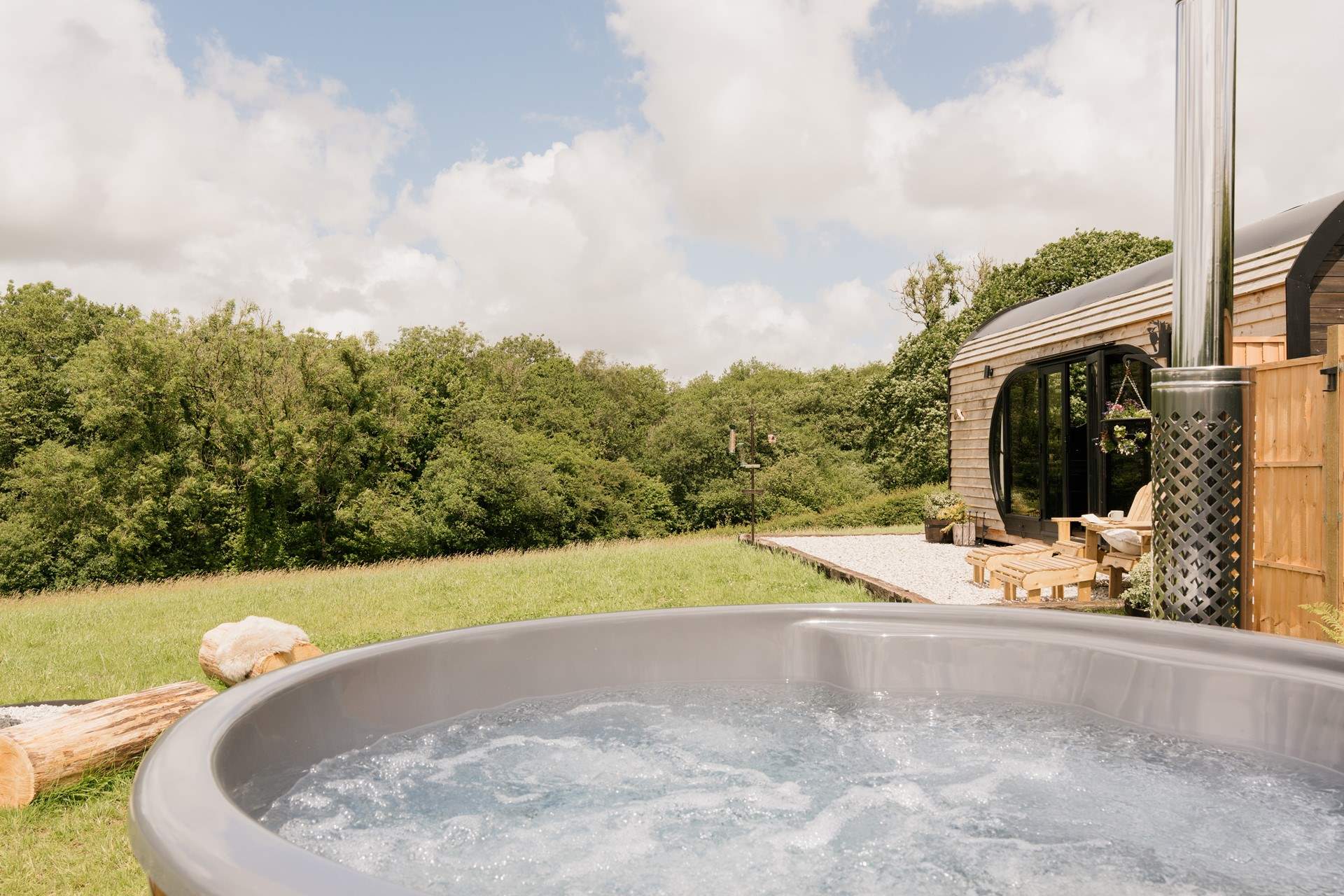 Soak away your worries in the bubbling wood-fired hot tub.