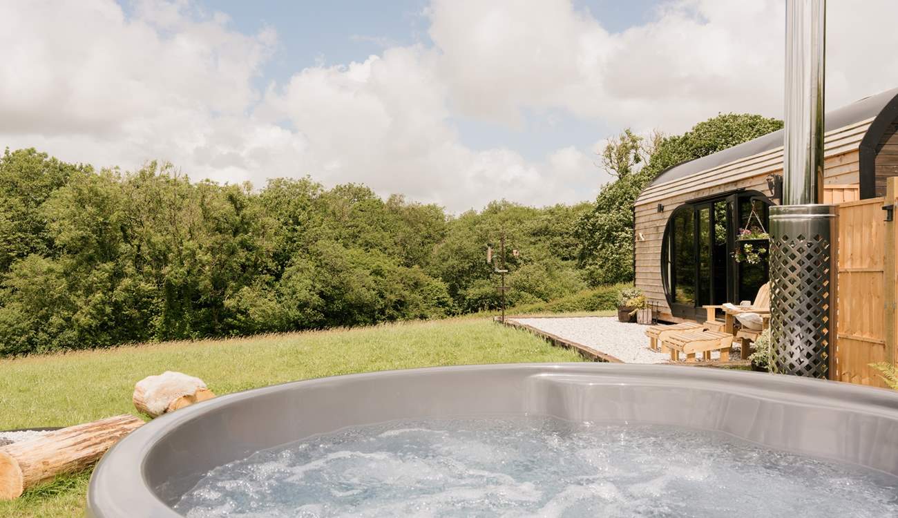 Soak away your worries in the bubbling wood-fired hot tub.