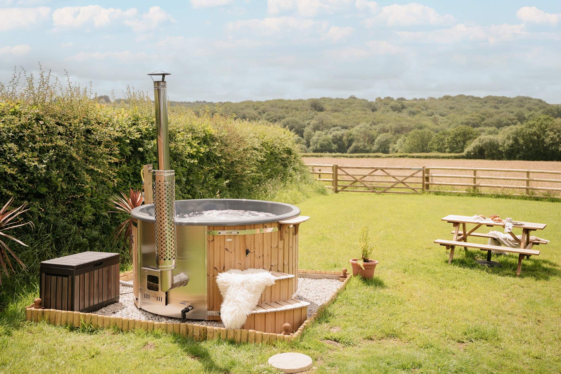 Enjoy the steaming hot tub with calming countryside in every direction.