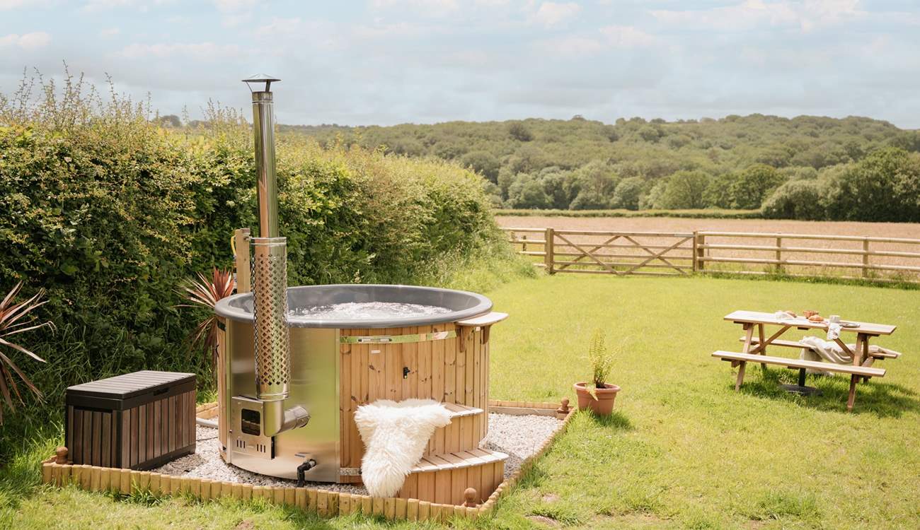 Enjoy the steaming hot tub with calming countryside in every direction.