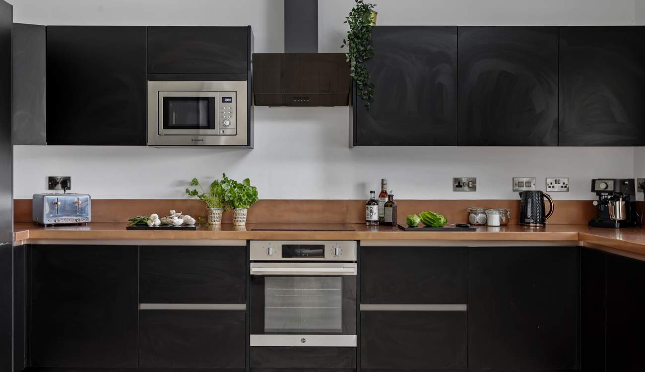 The stylish kitchen is beautifully appointed.