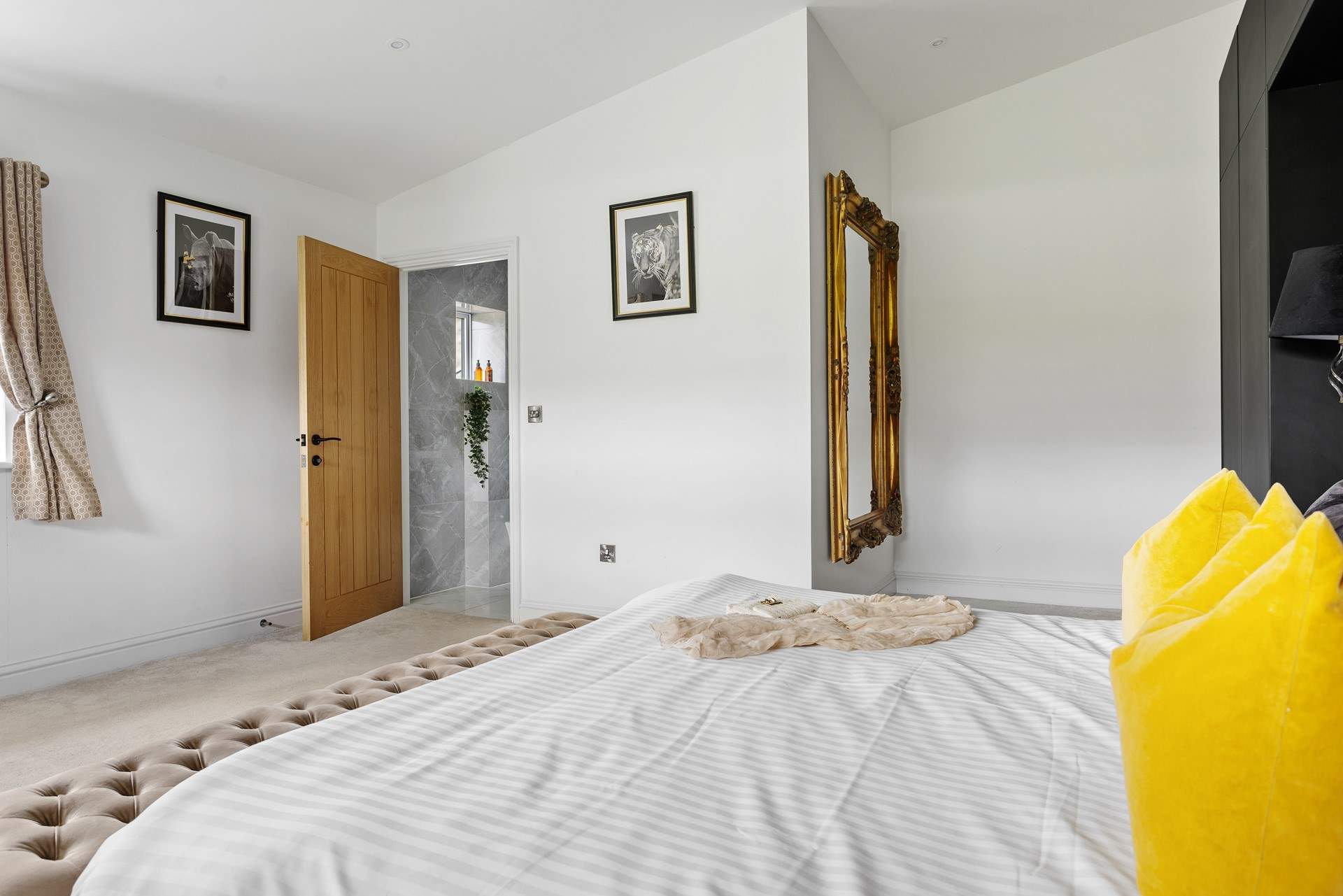 Incredibly spacious, the bedroom also boasts an en suite shower-room.