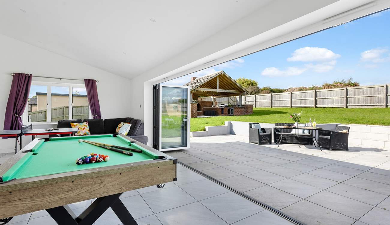 The huge bi-fold doors really connect the inside with the great outdoors.