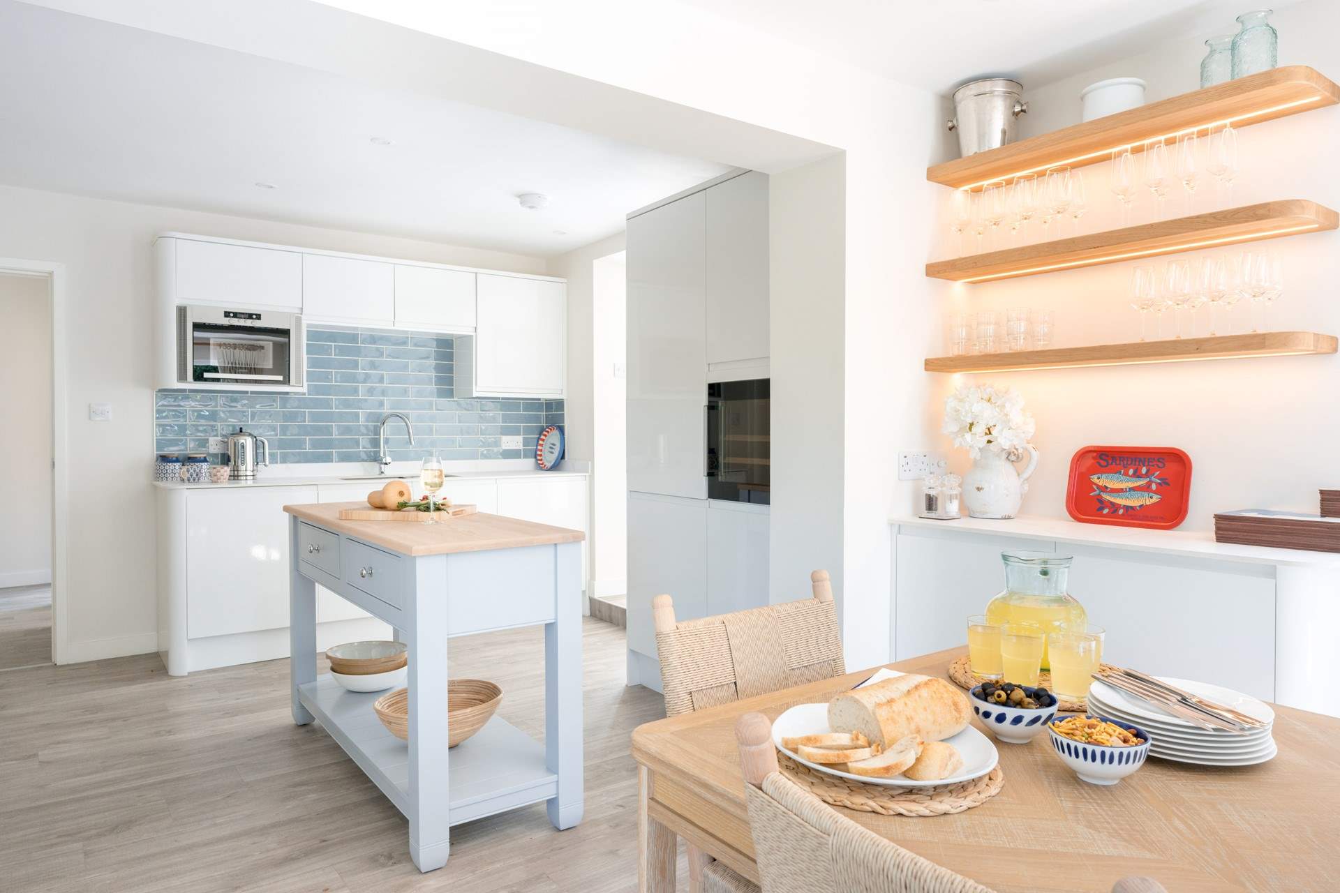 The kitchen is bright and fully-equipped with that all-important wine fridge...