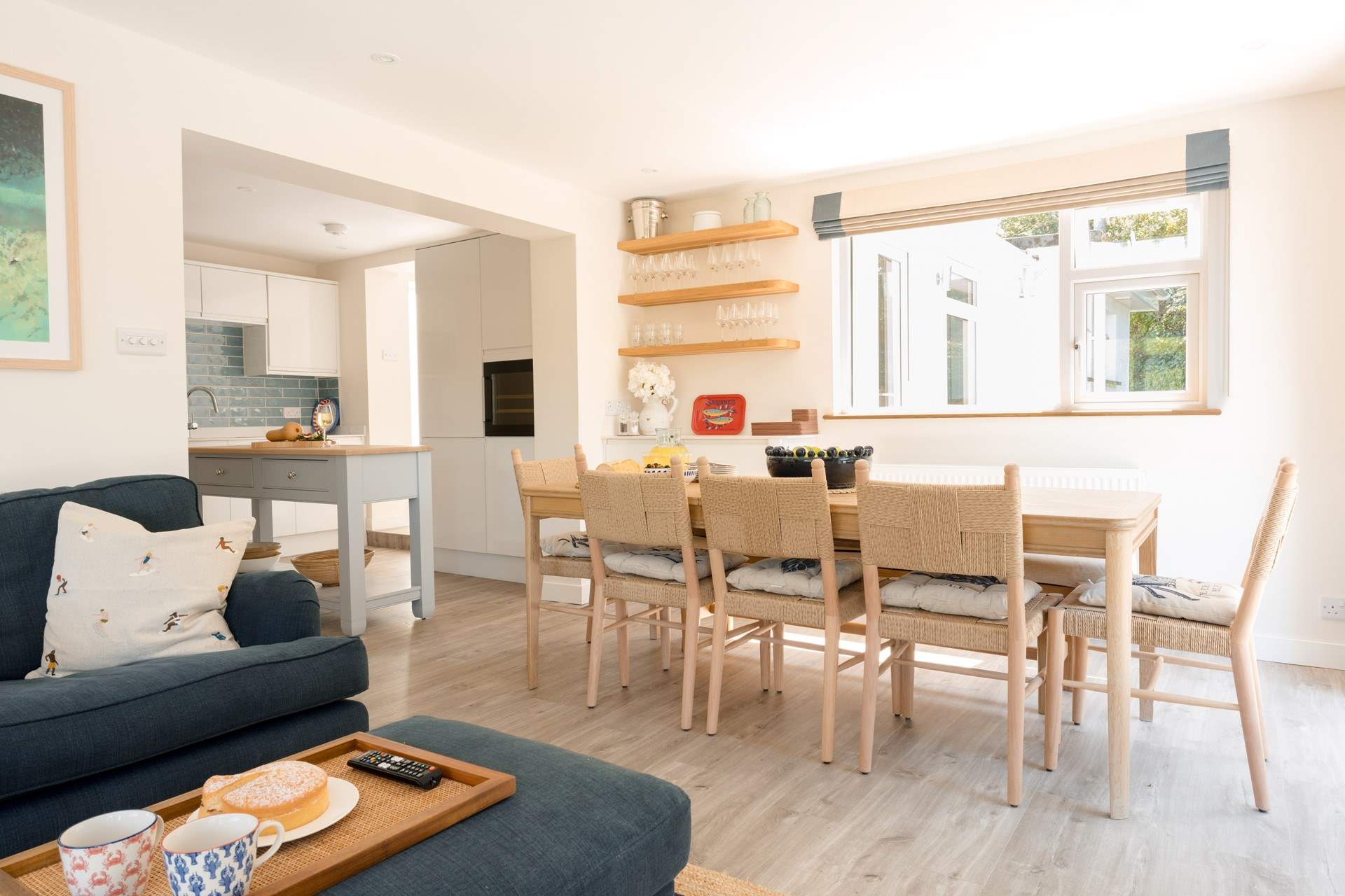 The kitchen and dining-table sit side by side.