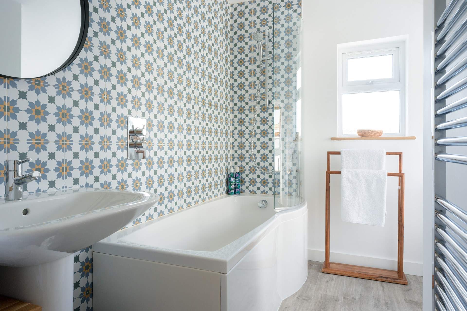 Lastly, the stylish family bathroom with bath and a fitted shower.
