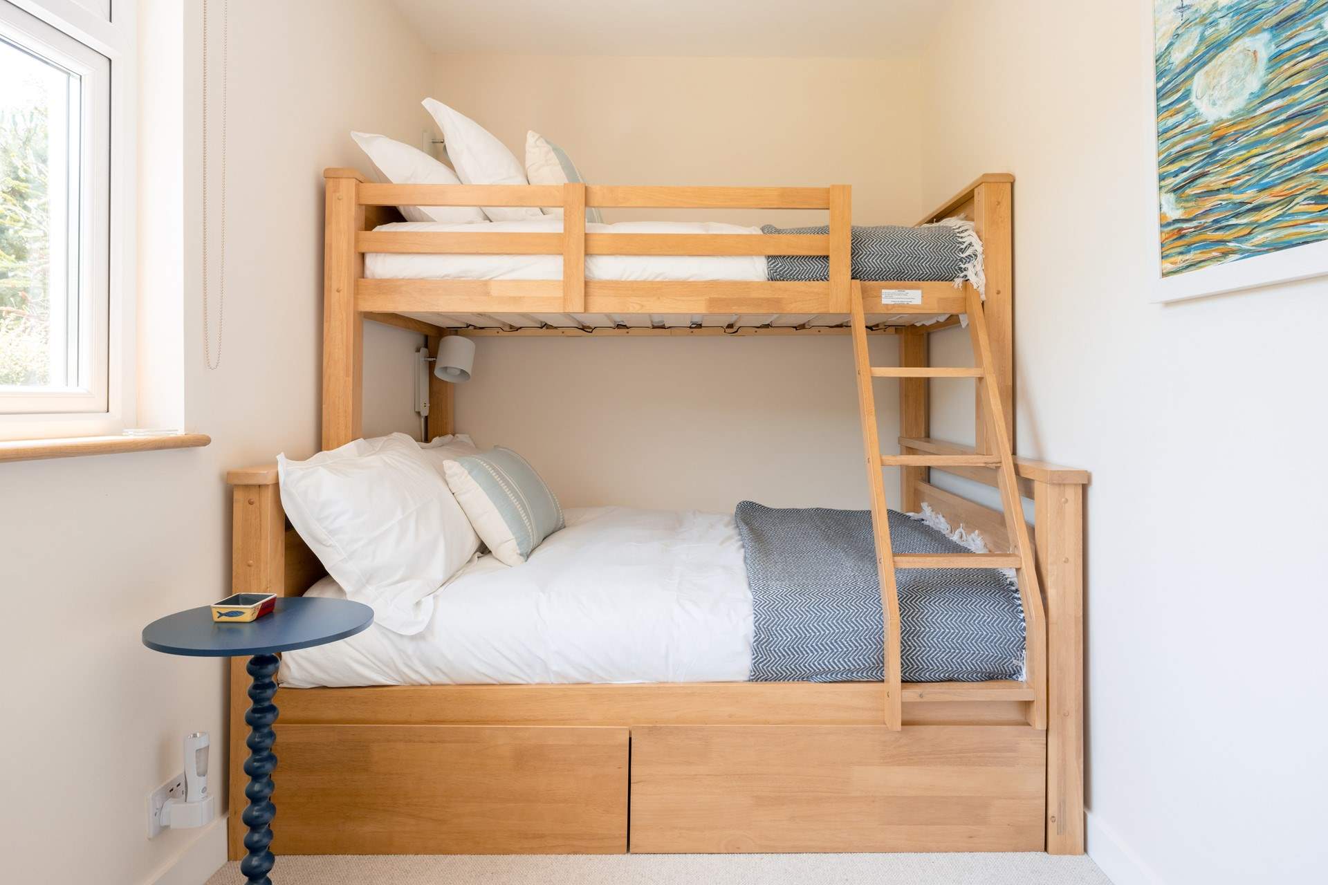 Head back out to the landing and discover the bunk bedroom with a single bunk-bed on top and a double on the bottom.