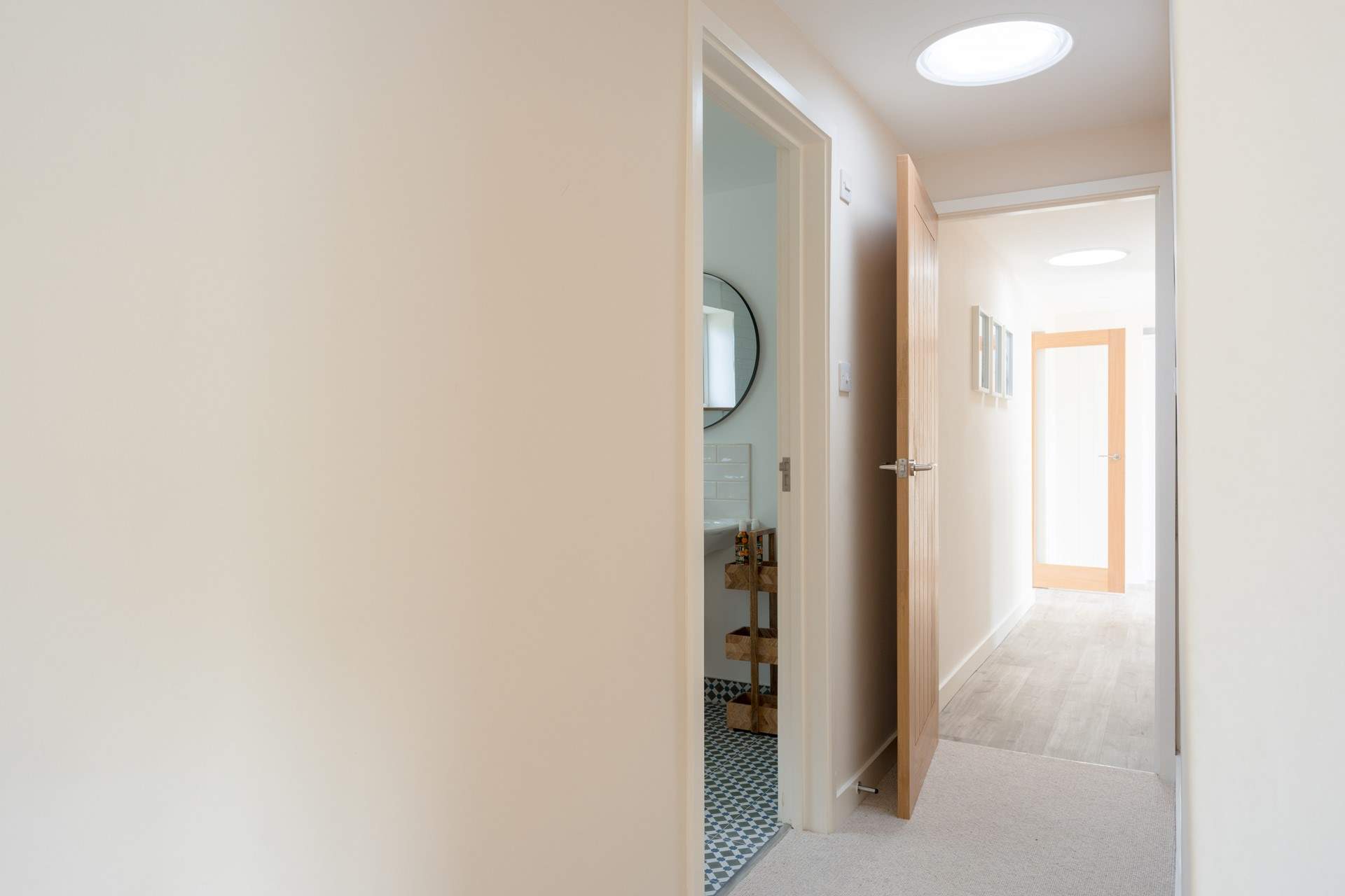 From your bedroom door you will pass bedroom 2, the utility-room then on to the kitchen.
