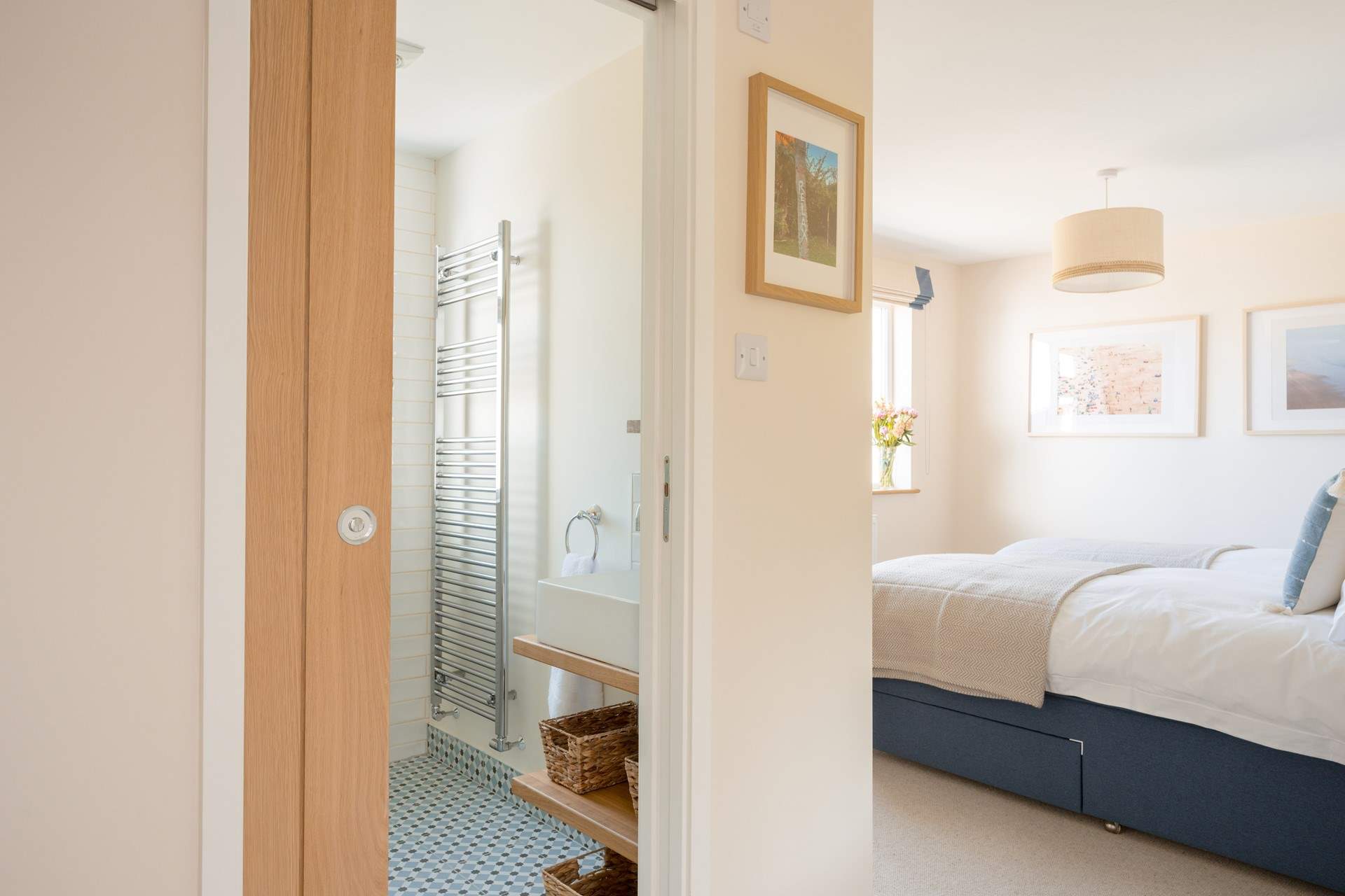 Bedroom 2 has a 'zip and link' king-size bed and an en suite shower-room with fabulous floor tiles.