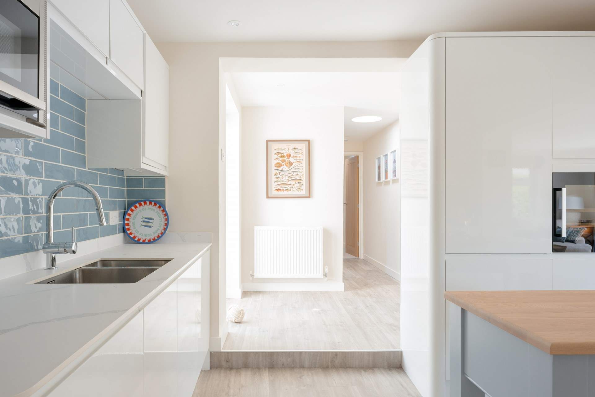 Head through the kitchen, passing another door to the garden, and you will discover a further two en suite bedrooms along with a utility-room.