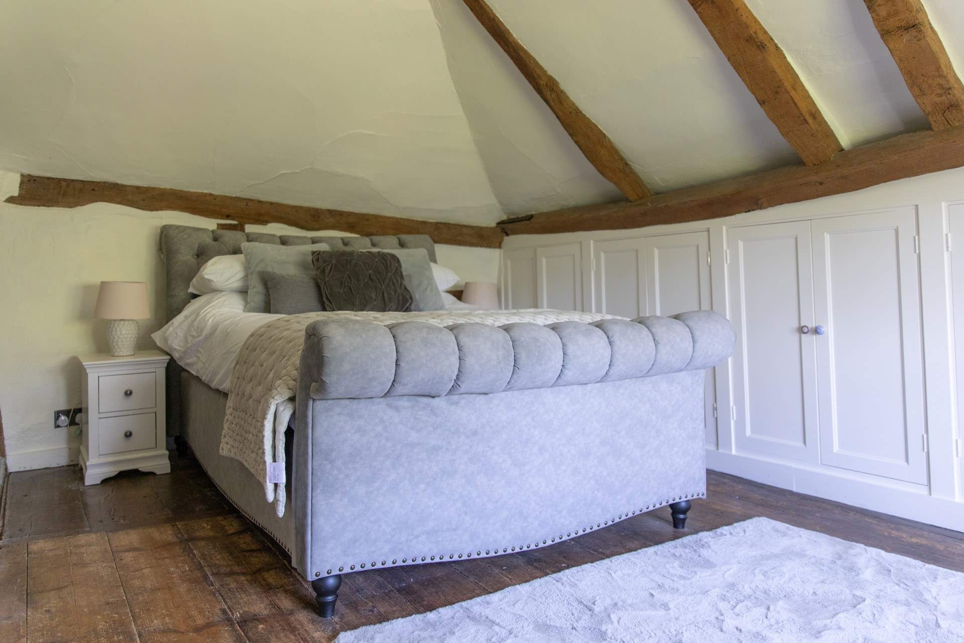 The bedrooms have lots of historic charm with sloping ceilings and floors.