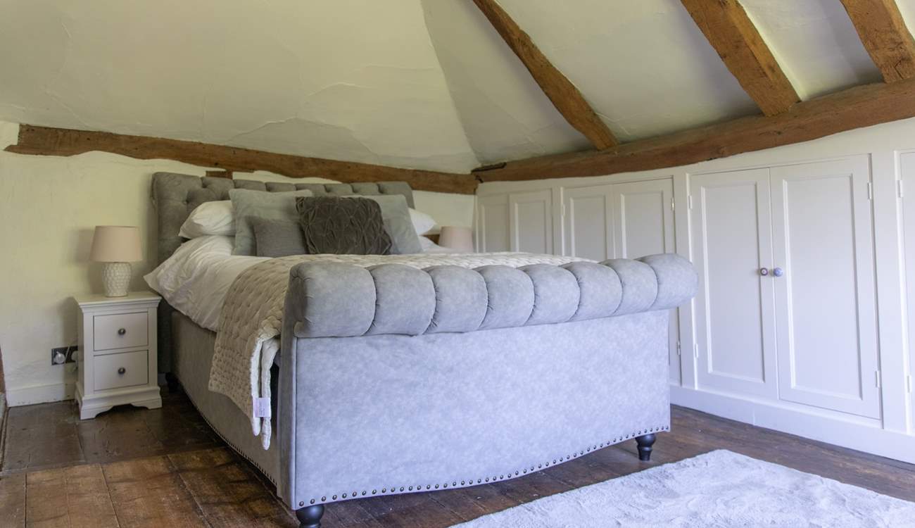 Bedroom 2 - The bedrooms have lots of historic charm with sloping ceilings and floors.